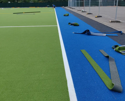 Sand dressed carpet with a contrasting perimeter margin